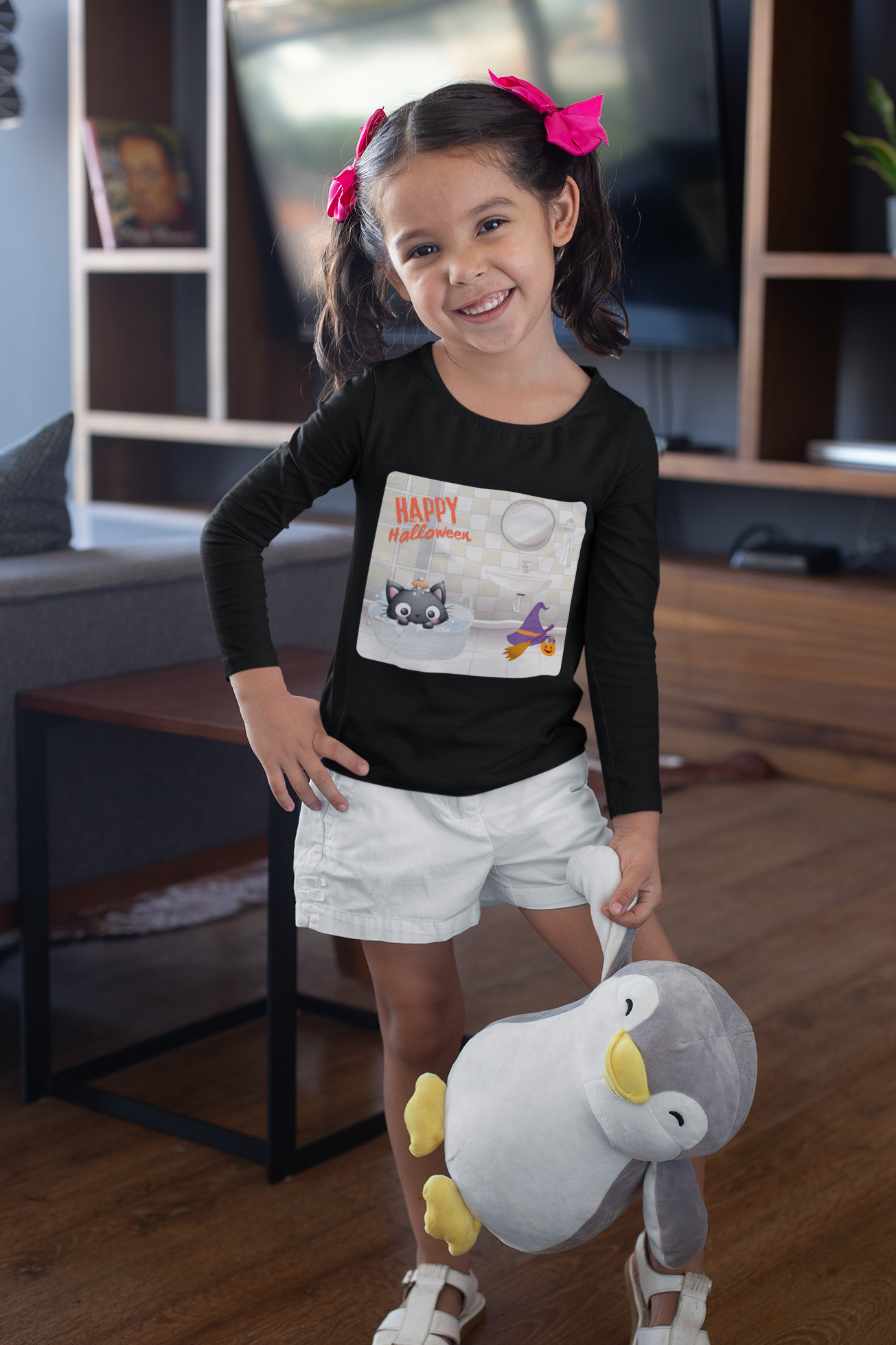 Child holding a plush toy in a living room setting