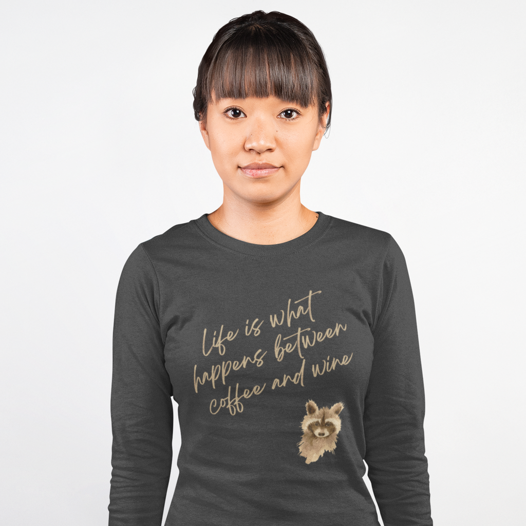 Person wearing a dark gray long-sleeve shirt with text and a dog illustration on a white background