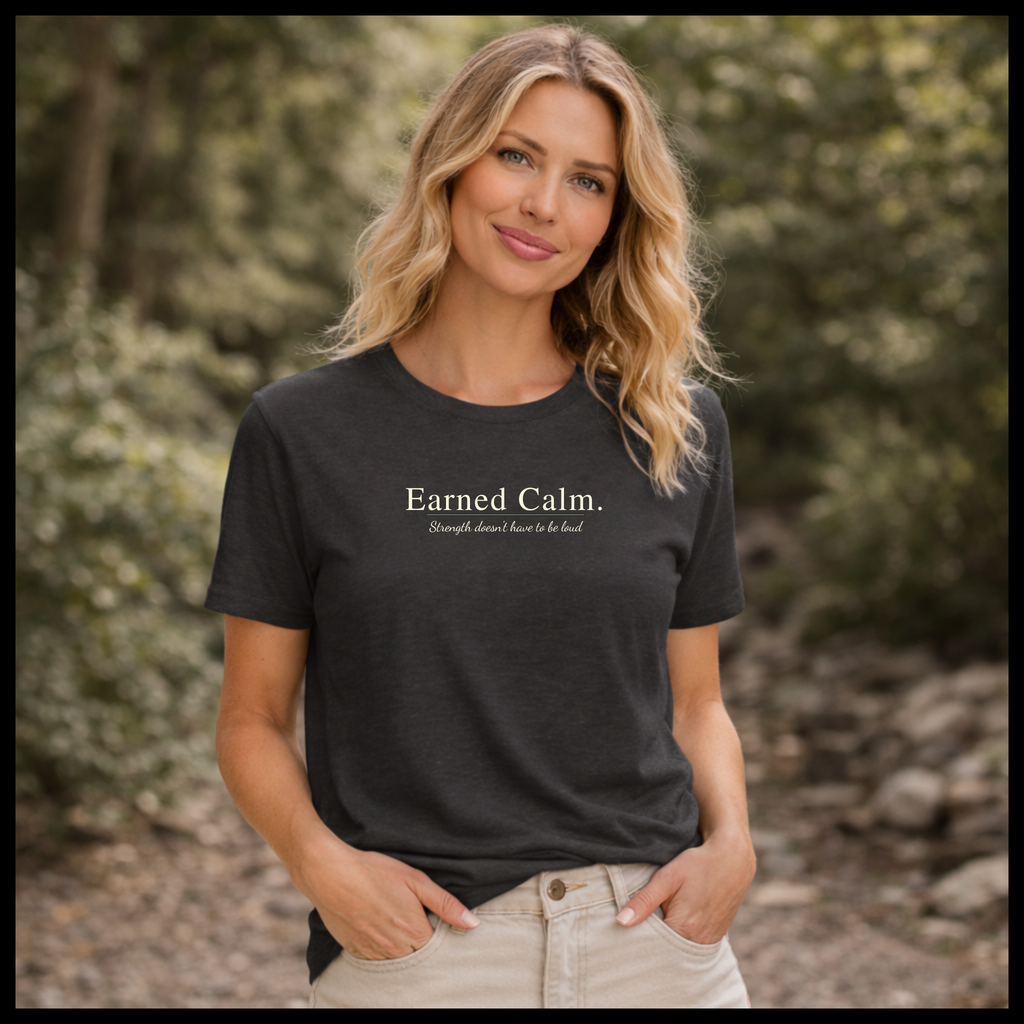 Earned Calm minimalist t-shirt featuring a quiet strength quote. Soft, modern unisex tee designed for calm confidence and everyday wear.