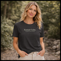 Earned Calm minimalist t-shirt featuring a quiet strength quote. Soft, modern unisex tee designed for calm confidence and everyday wear.