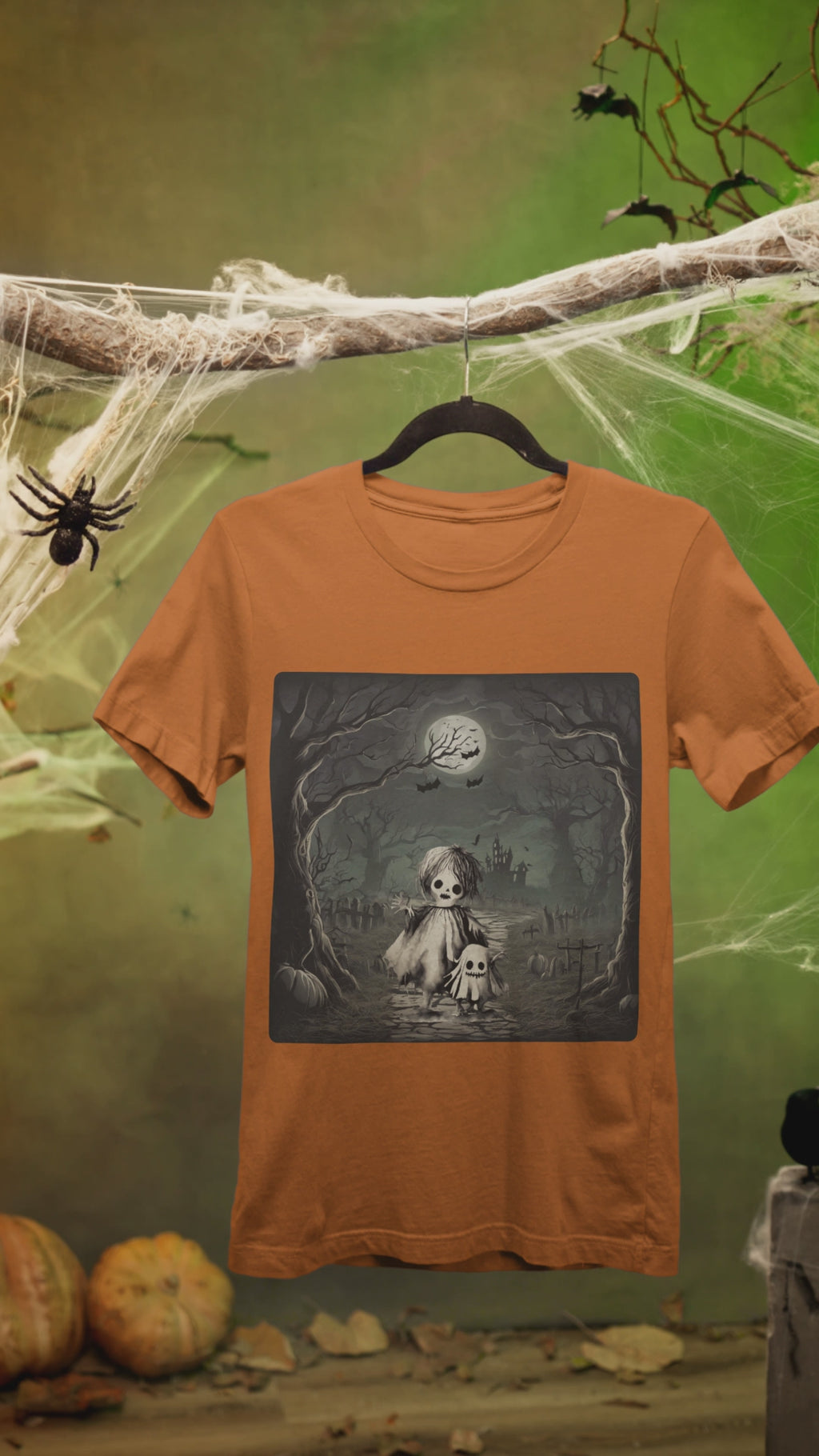 video of auburn tee with a ghost and skeleton design.